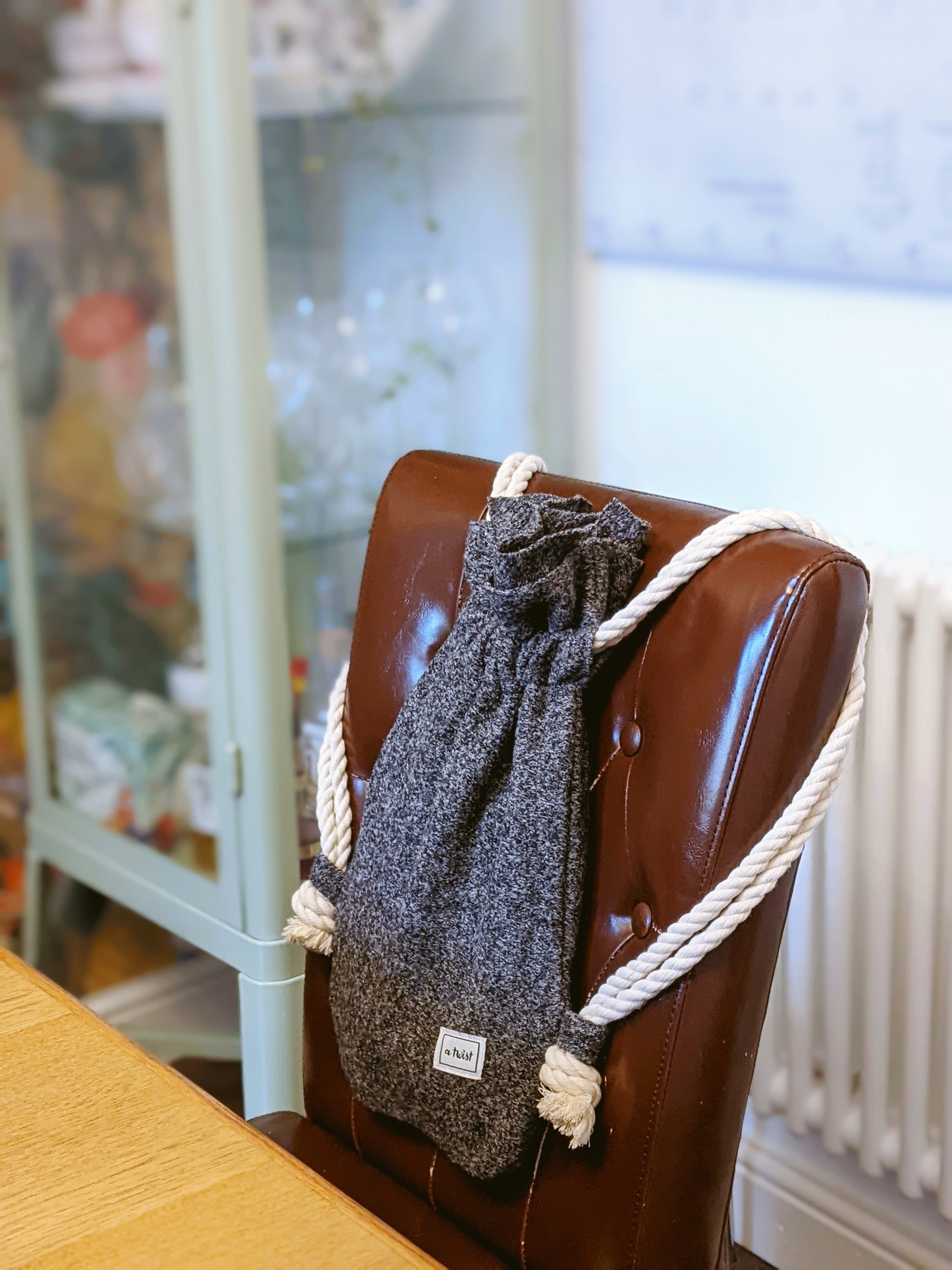 Hot Water Bottle Bag grey hang on chair
