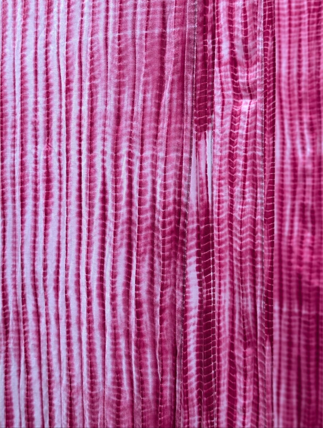 Close-up of pink, red and white striped fabric texture