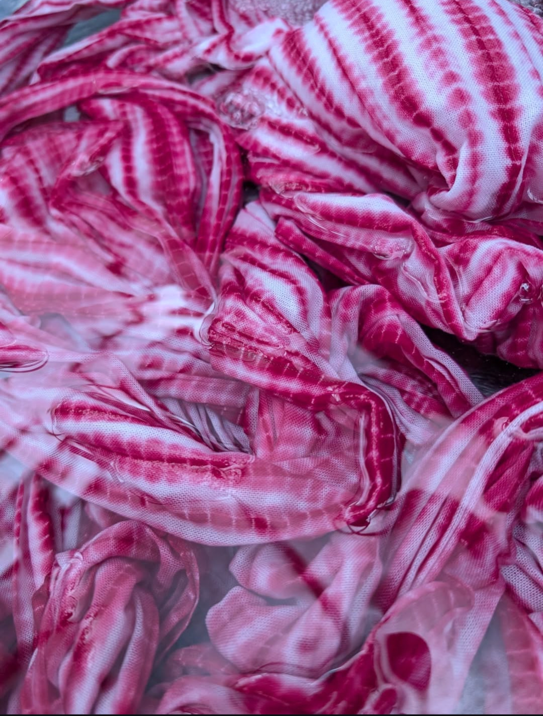 Close-up of pink, red and white striped fabric