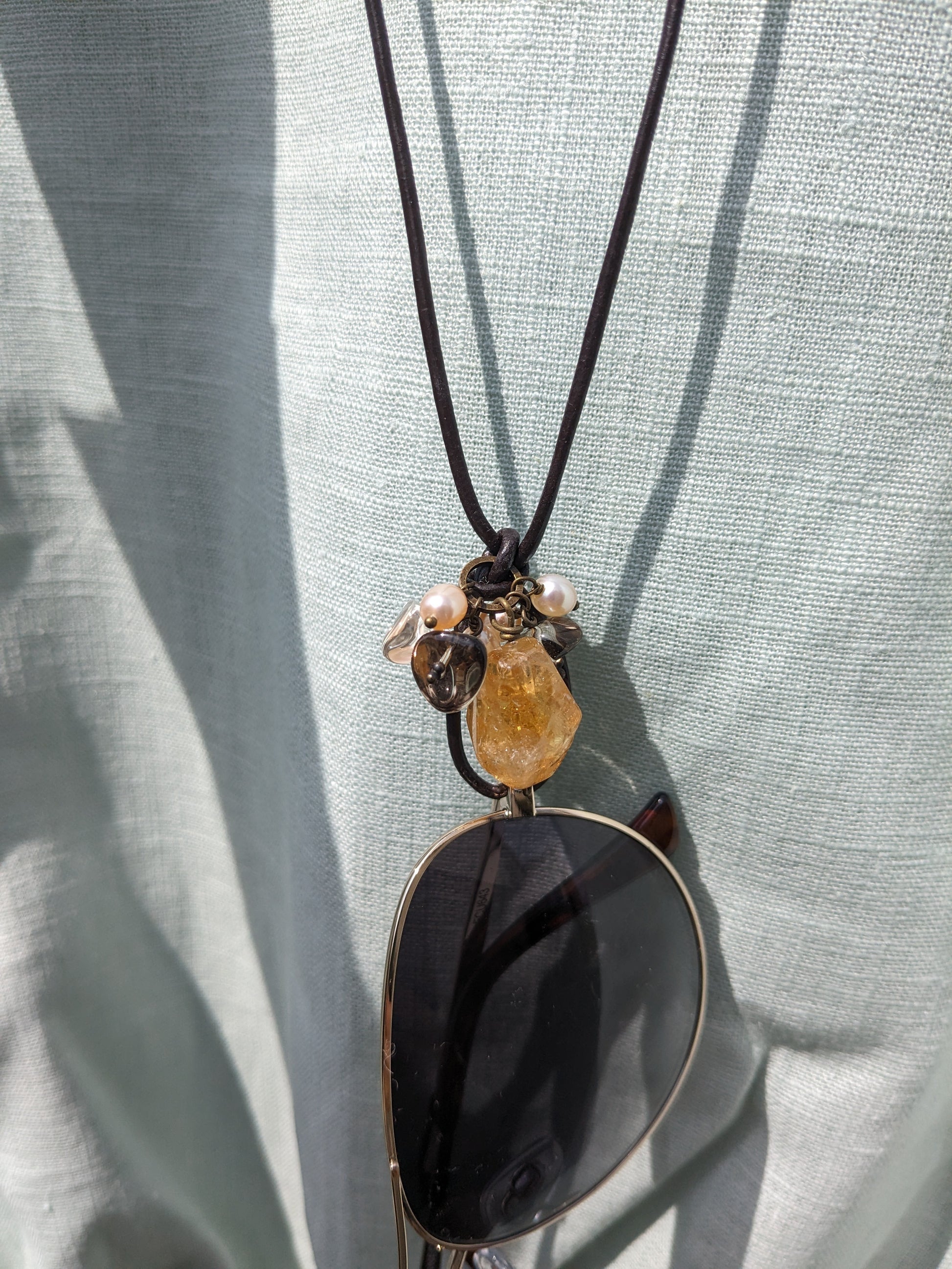 Sunglasses or Reading glasses Necklace with natural stones on a linen shirt