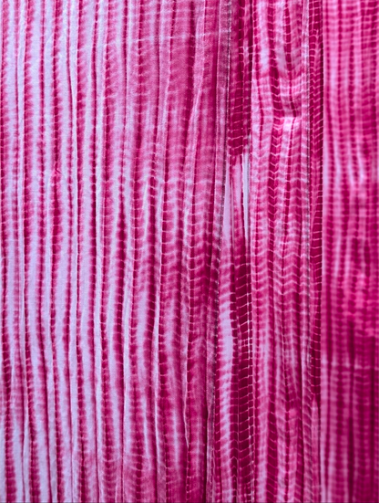 Close-up of pink, red and white striped fabric texture