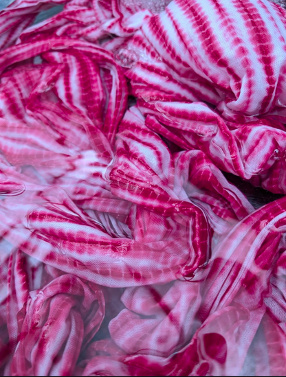 Close-up of pink, red and white striped fabric