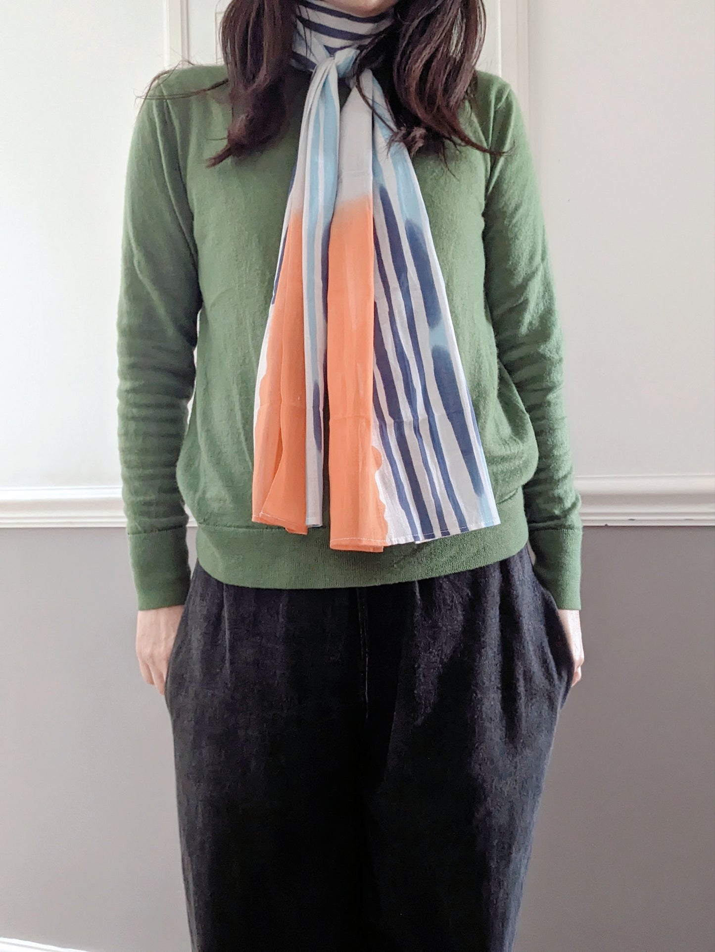 Nijiyura Chusen Gauze Tenugui Scarf - Sunset soft gauze scarf with a green jumper